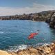 kayaks in the water near sand stone cliffs in La Jolla california - San Diego Valentine's Day