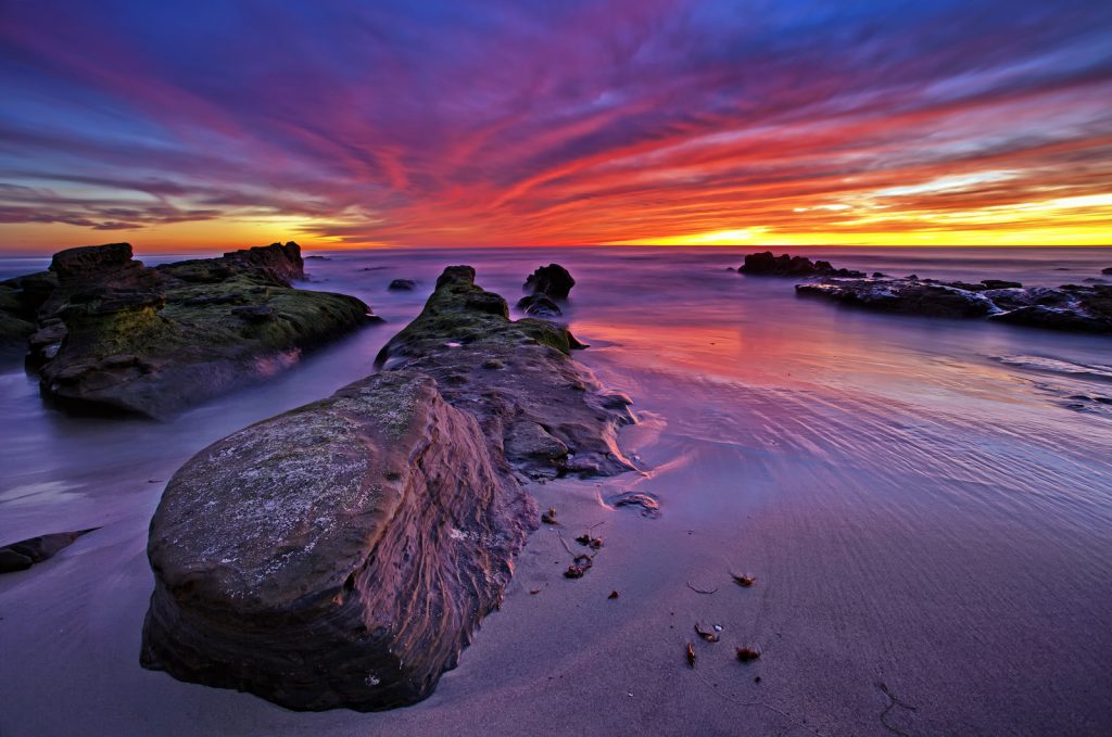 Amazing sunset lights up Windansea Beach in La Jolla, San Diego, California
