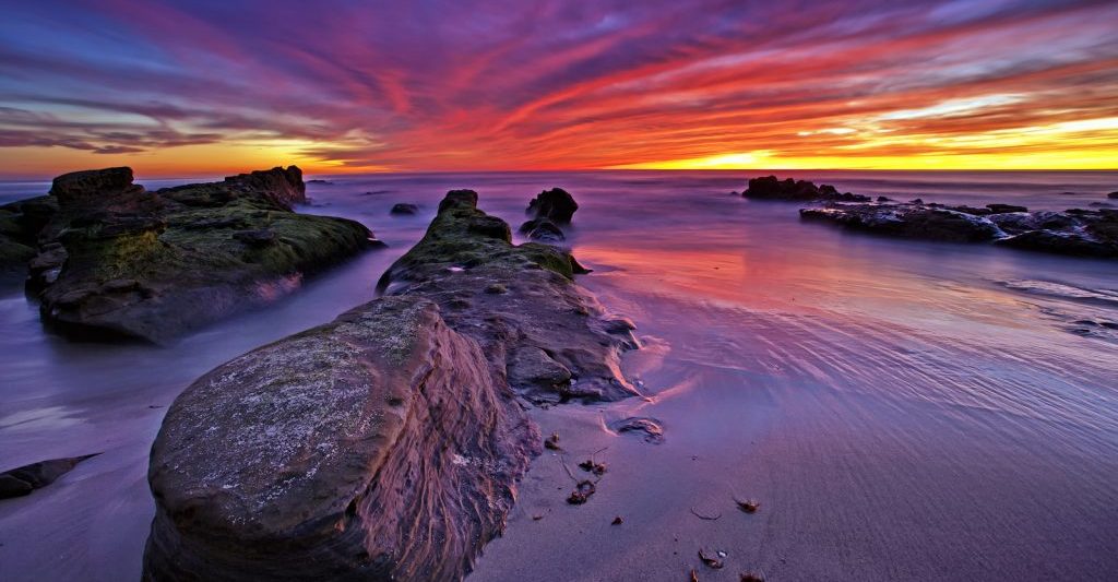 Amazing sunset lights up Windansea Beach in La Jolla, San Diego, California