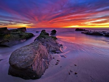 Amazing sunset lights up Windansea Beach in La Jolla, San Diego, California