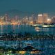 San Diego downtown skyline at night with boat in harbor.