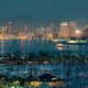 San Diego downtown skyline at night with boat in harbor.