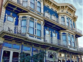 Facade of Horton Grand Hotel in San Diego - Victorian style building with white stucco and blue paint