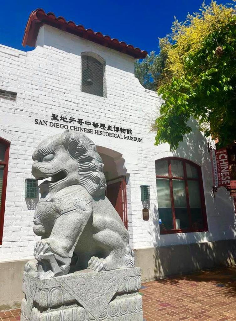Entrance to the San Diego Chinese Historical Museum with lion statue in front