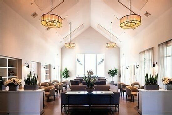 Indoor tasting room at Bottaia Winery with modern furniture and white walls