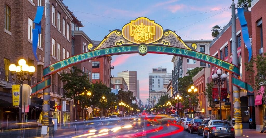 Decorative and lid up street sign over 5th avenue in the Gaslamp Quarter San Diego
