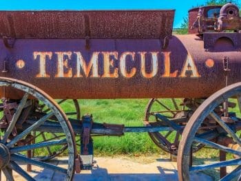 Historic, rusty railway cart with Temecula etched into the side