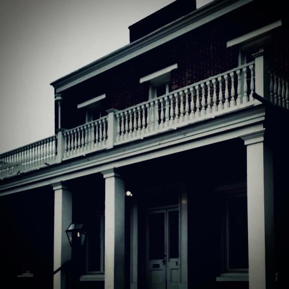 Black and white photo of the Whaley House - spooky looking