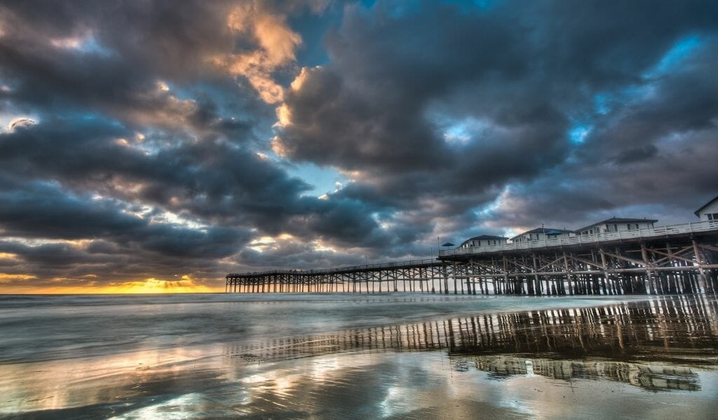 Dramatic cloudy sky during sunset over Crystal Pier Pacific Beach - San Diego Sunsets