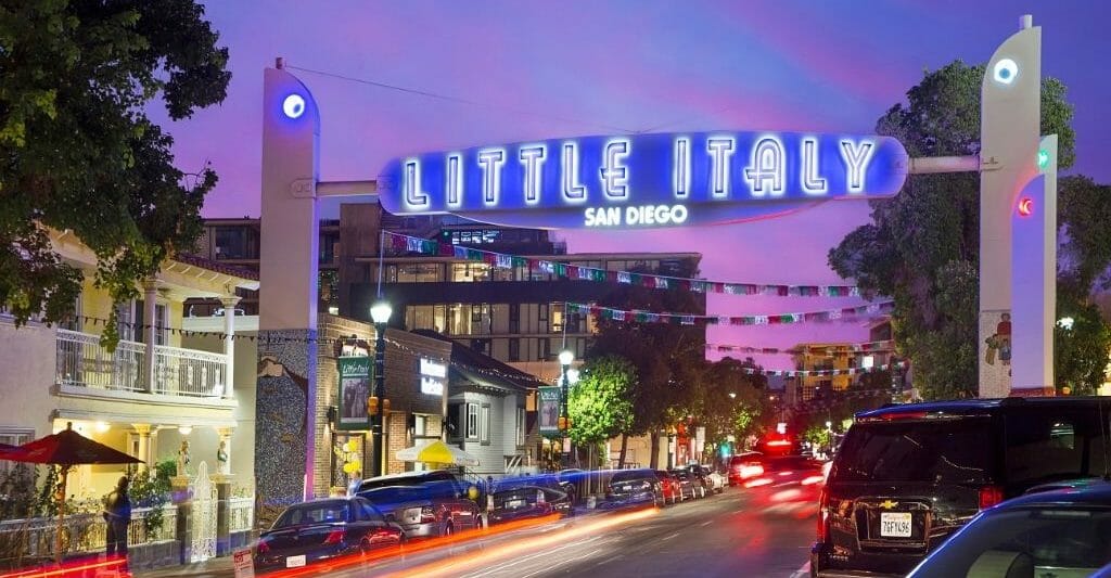 Neon sign "Little Italy" over street in Little Italy San Diego during sunset