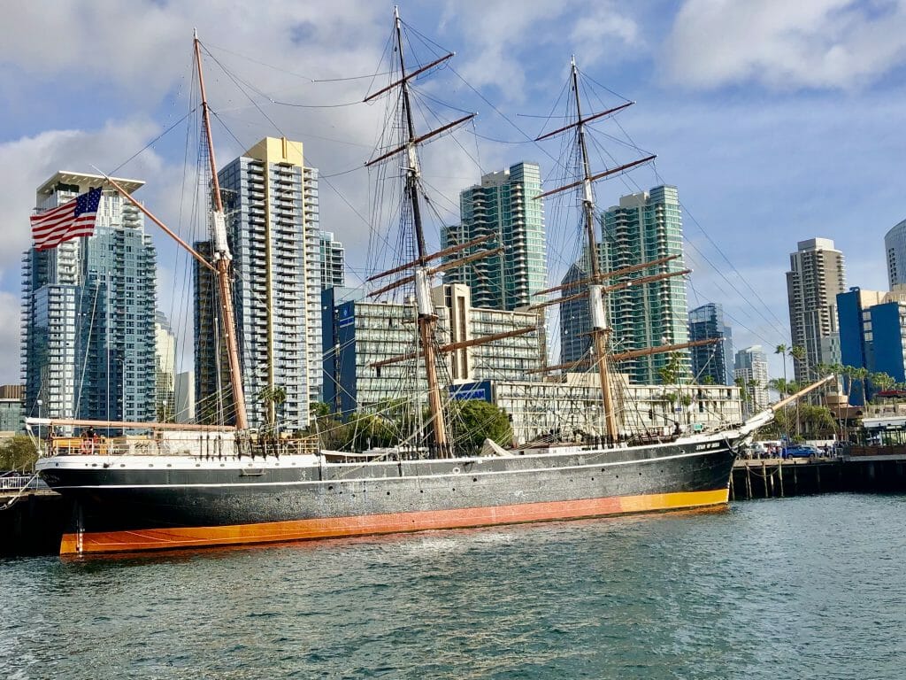 Historic Sailboat Star of India with highrises of San Diego Downtown in the Background