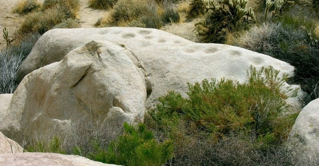 Grinding holes in a large stone boulder - Kumeyaay Tribe history San Diego