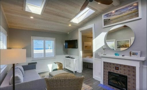 living room with fireplace and couch and ocean theme decor - La Jolla vacation rentals