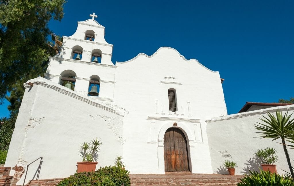 White spanish style church with 5 bell tower - San Diego Mission - San Diego History
