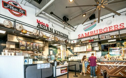 Inside of Little Italy Food Hall - order counters of MeinSt Asian Kitchen & Samburgers food station