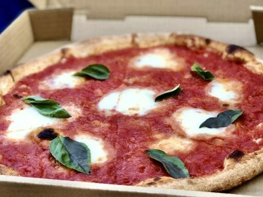 Margarita Pizza with red sauce, cheese and Basil