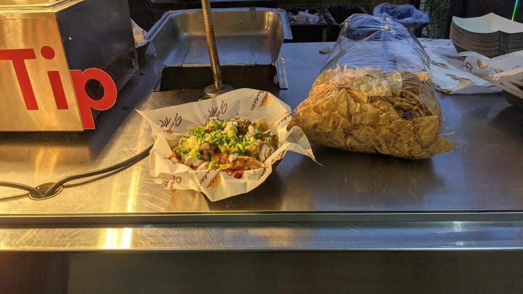 Counter with two bowls of nachos