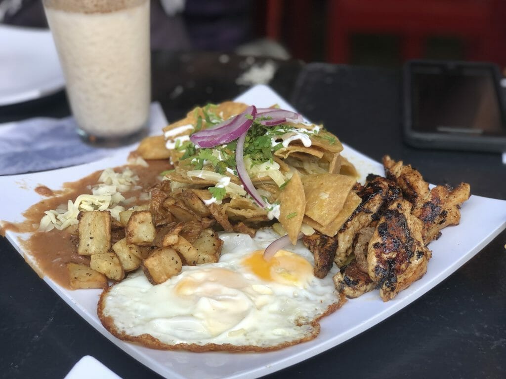 Breakfast at La Tradition Tijuana: eggs, chicken, chilaquiles, beans