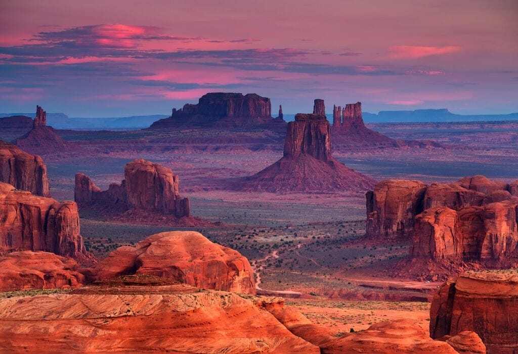 Sunrise over the red rock formations at Monument Valley Arizona