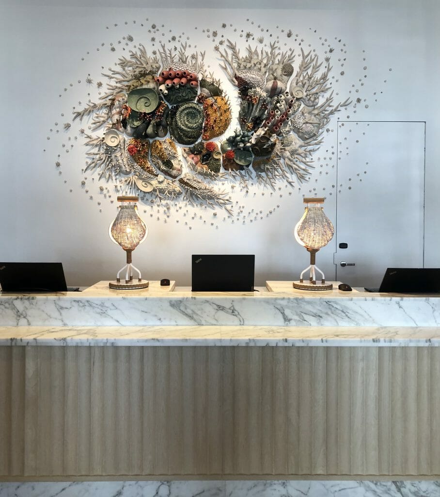 Artwork over Checkin Desk at Blue and white macrame ceiling art at The Seabird Resort Oceanside