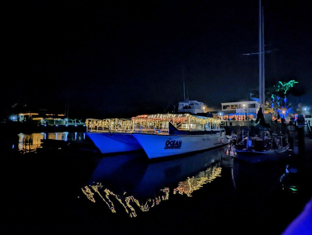 Boat decorated with white lights at Dana Point Harbor