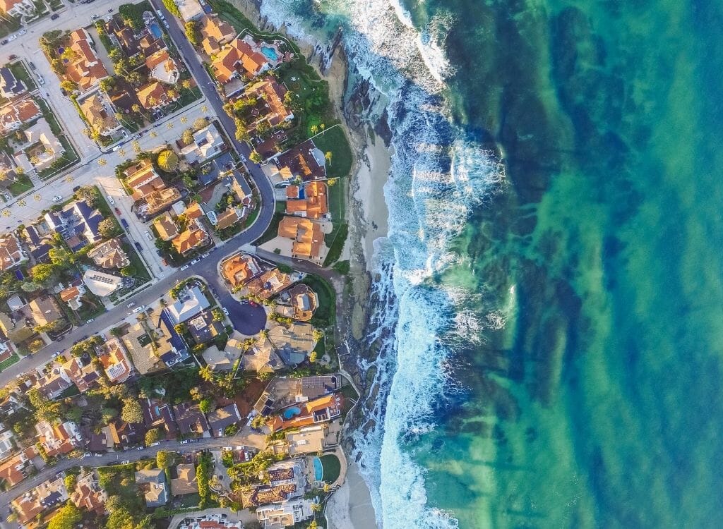 aerial view of La Jolla with ocean on the right and houses on the left