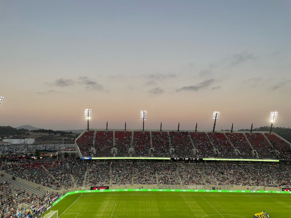 Sunset over large outdoor stadium set up for soccer game. Snapdragon Stadium, SDSU Stadium, San Diego.