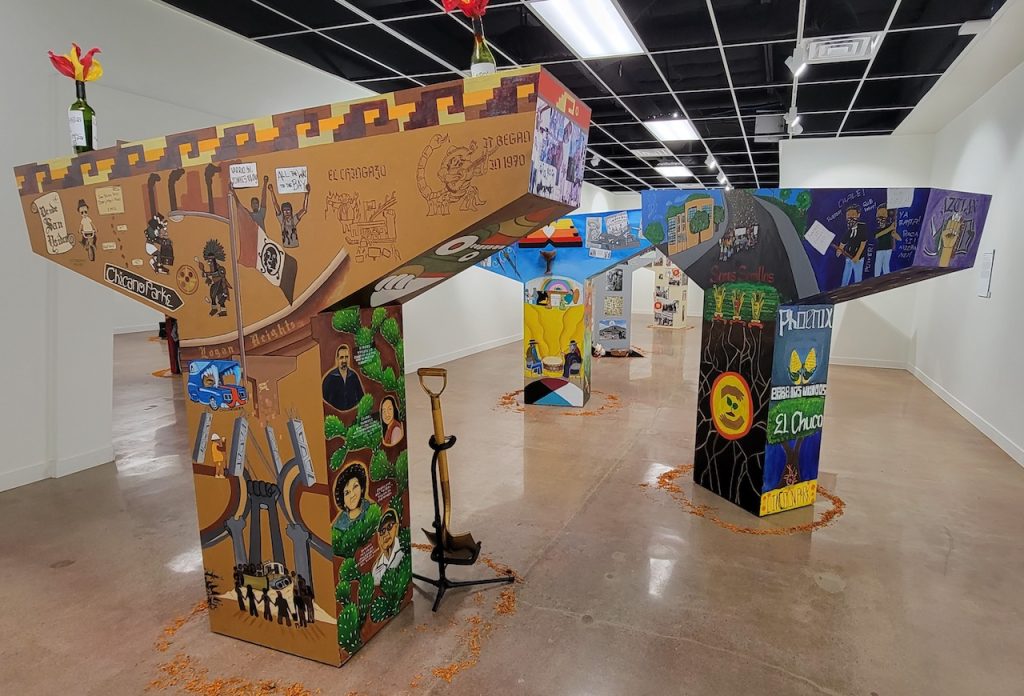 Model pillars painted in colorful elaborate murals inside The Chicano Park Museum and Cultural Center