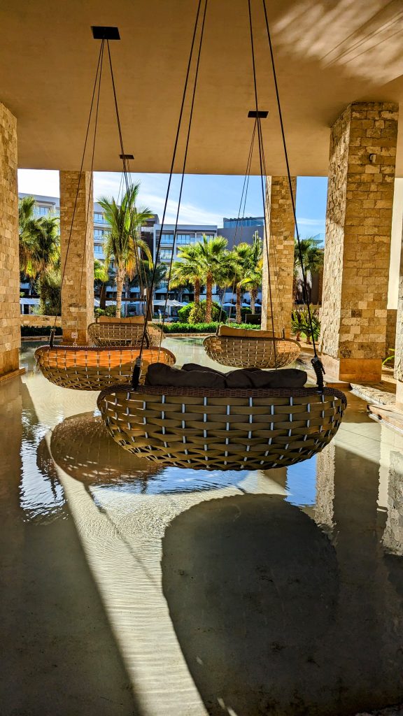 large swings with cusions over pool at Hard Rock Hotel Los Cabos