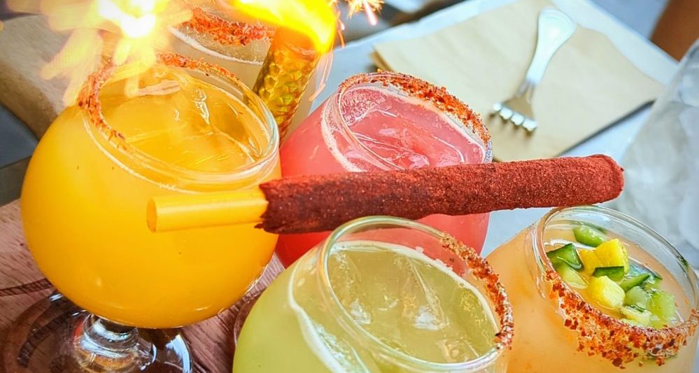 4 flavors of mimosas with tamarind straw and firey sparkler at King and Queen cantina