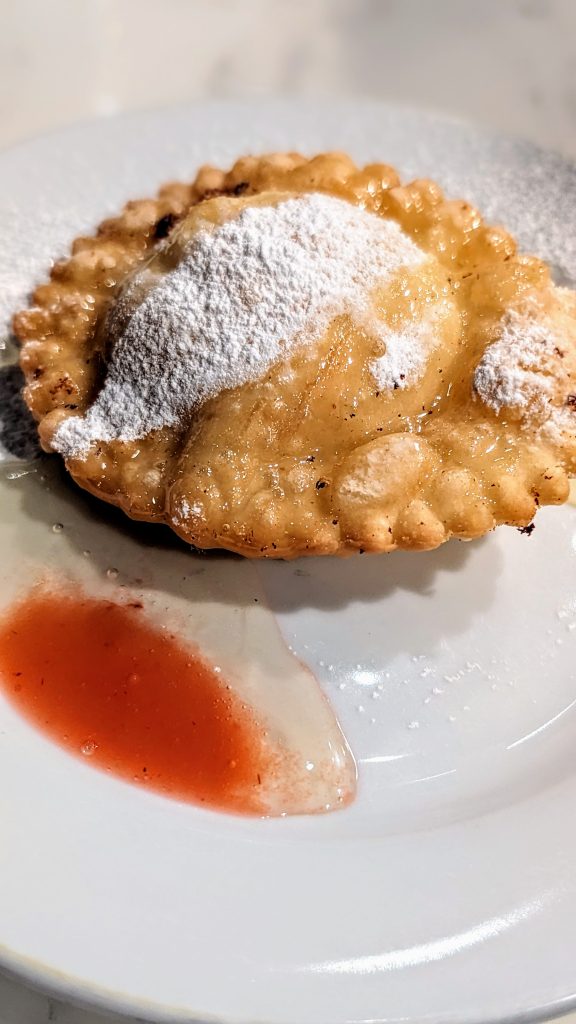 Ravioli tasting menu at Ciccia Osteria - fried ravioli with powdered sugar and honey drizzle - Dessert