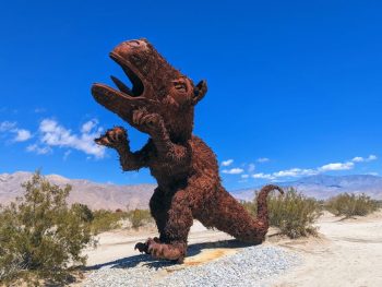 huge rusty metal dinosaur sculpture at Galleta Meadows Estate Borrego Springs - San Diego Day Trips