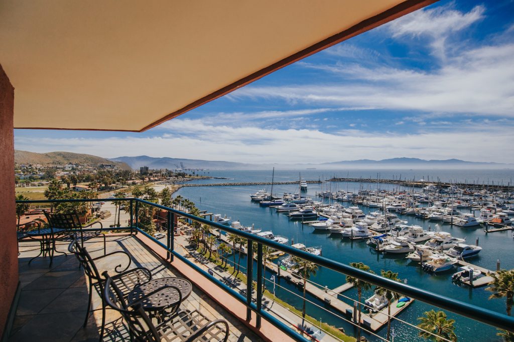 Balcony views overlooking marina full of boats on sunny day. Hotel Coral y Marina, Ensenada, Mexico hotels.