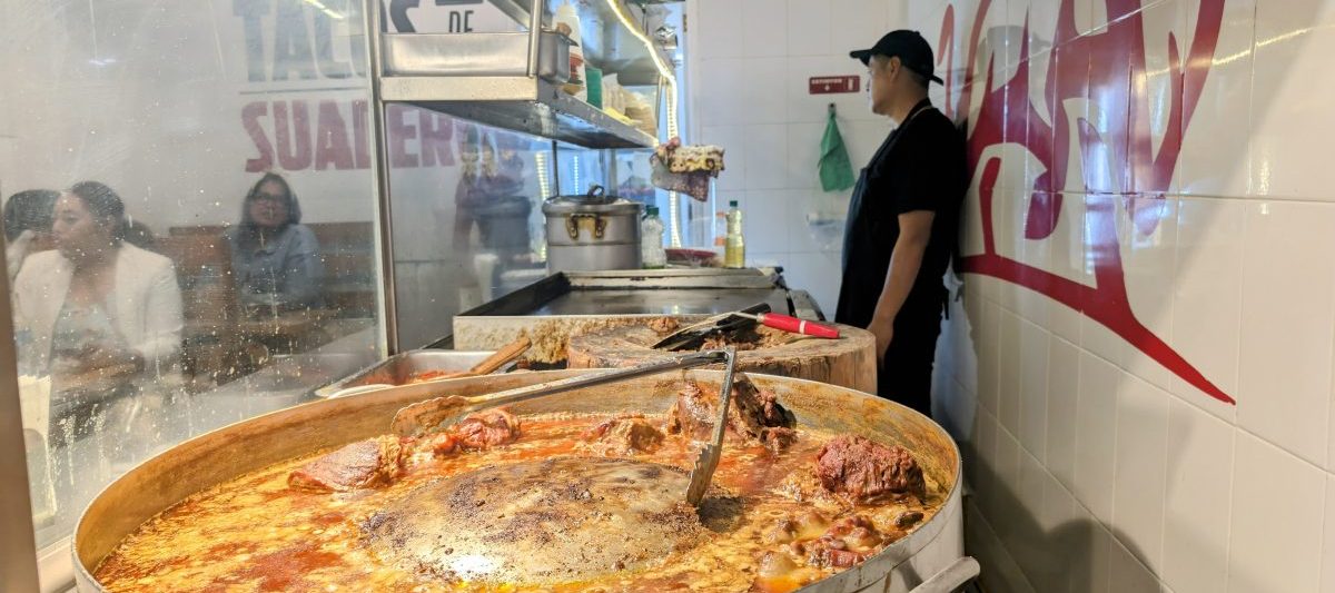 Big pot of stewing meat at a taco shop in Mexico City
