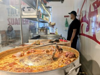 Big pot of stewing meat at a taco shop in Mexico City