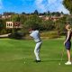 Man and woman playing golf at the Fairmont Grand Golf Club