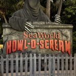 Creepy sign for Howl-O-Scream San Diego SeaWorld with "Grim Reaper"