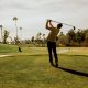 Man swinging golf club at La Valle Coastal Club