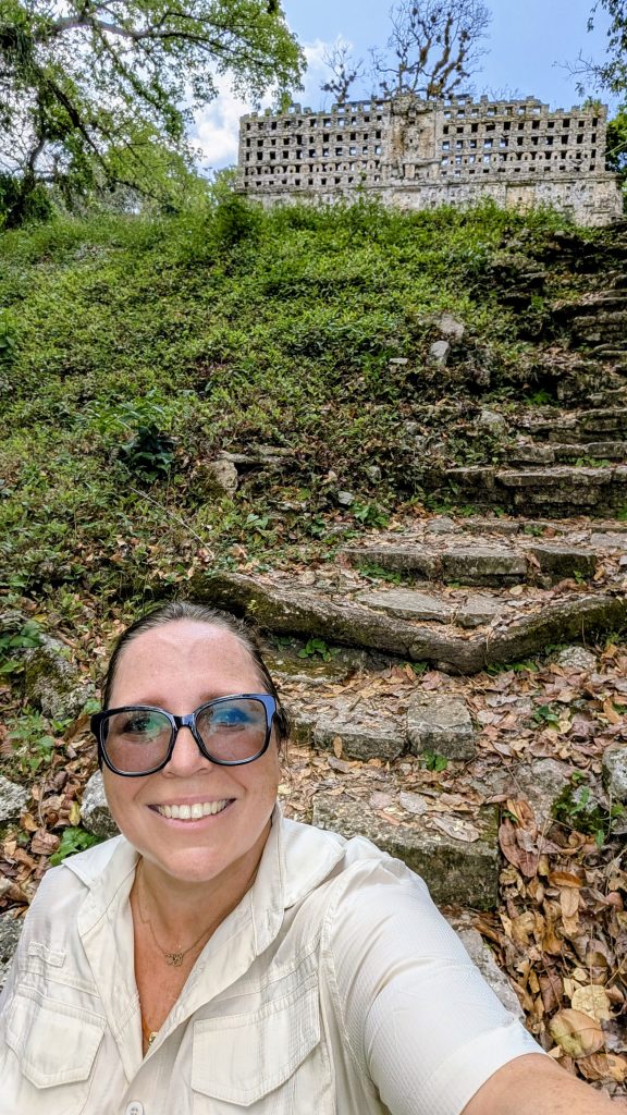 Maria Haase on Grand Staircase and Building 33 in the background at Yaxchilan Mayan Ruins