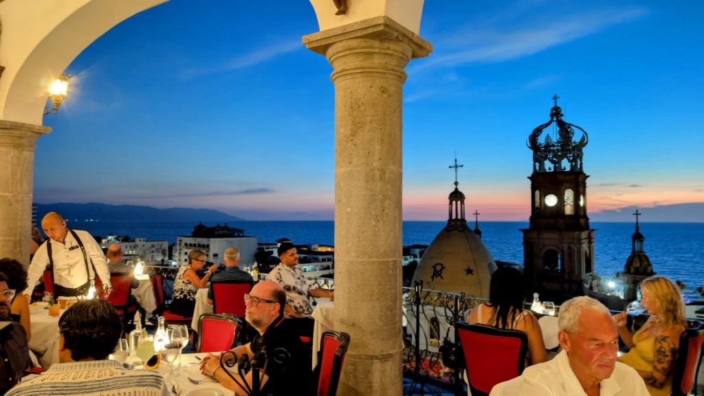 View from La Capella restaurant in Puerto Vallarta over cathedral and ocean during sunset