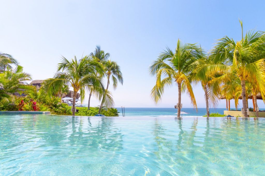 Armony Marival Pool  with palm trees in view